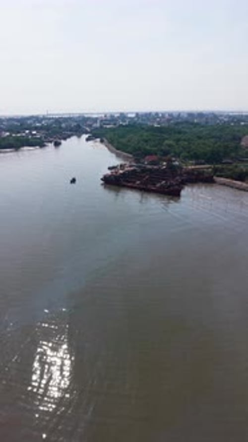 Aerial (Vertical ) View of a Small Boat Coming From the Port in Vietnam.