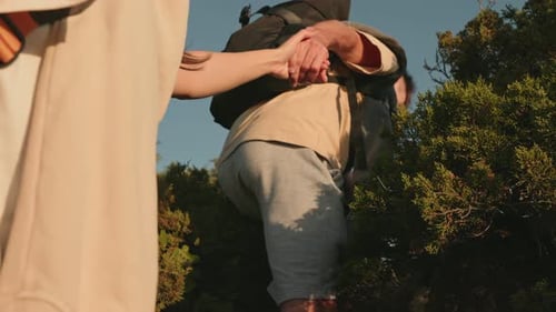 Couple Hiking Hand-in-Hand in Natural Setting