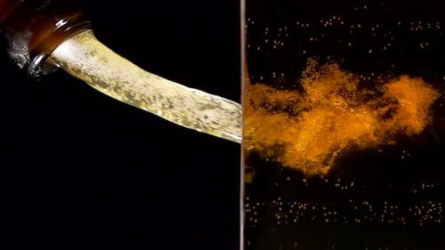 Super Slow Motion of Clean Wine Glass with Champagne Bubbles Texture Filled with Dry Rose Wine