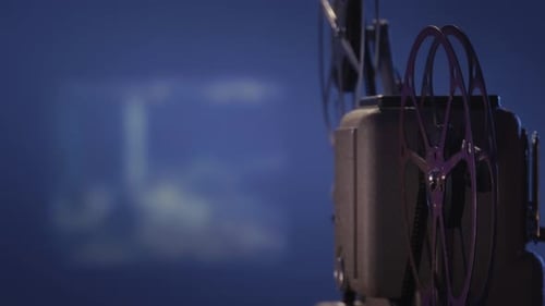 Antique Film Projector Playing a Retro Movie