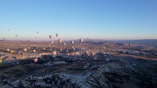 Aerial view of hot air balloons over rock formations, Turkey.