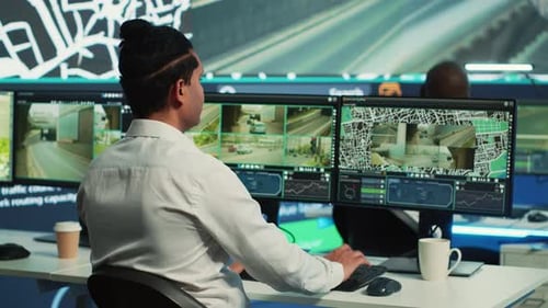 Security Analysts Working in Modern Control Room