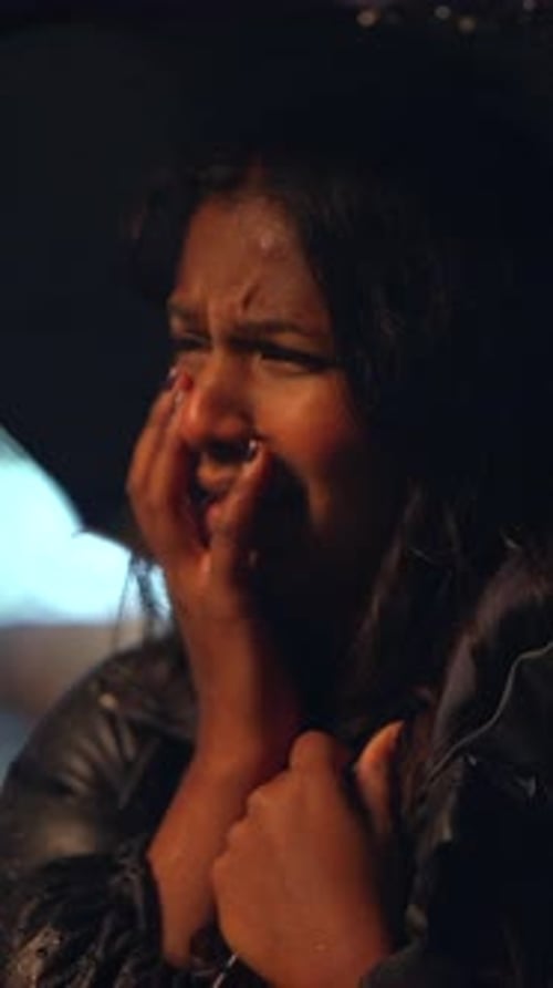 Woman Crying in the Rain at Night