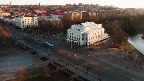 Aerial establishing shot of Stora Teatern theatre with old European architecture in Gothenburg. Peop