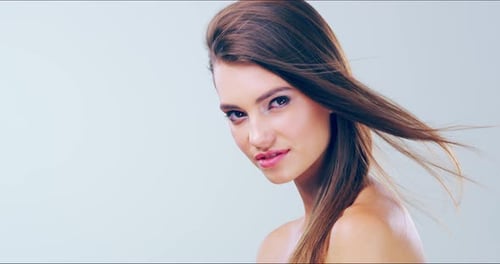 Elegant Woman With Flowing Hair Posing
