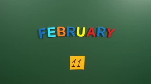 Hand sticking a sticker 11 February calendar day on school board. 11 date of February. Eleventh day