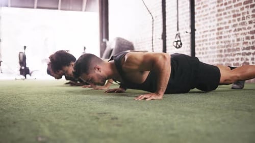 People, exercise and class push ups for workout fitness in gym for sports