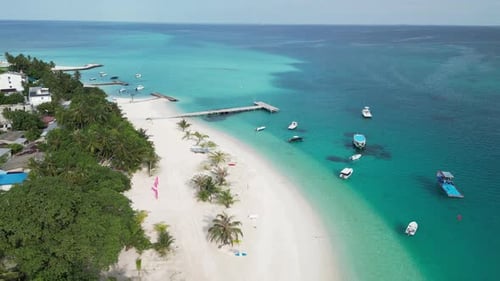 Pristine beach on tiny local island of Fulidhoo, Maldives. Aerial