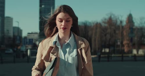 Beautiful Happy Successful Young Business Woman Walking Towards Camera Along Sunny Spring City Park