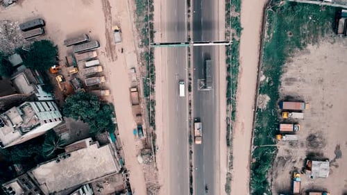 Aerial shot of a busy road where vehicles are passing in Dhaka, Bangladesh,