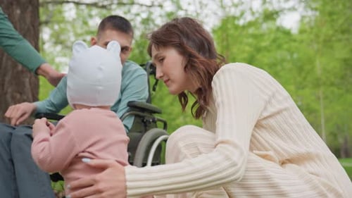 Child And Relatives Sharing Joyful Moments Outdoors With Kindness Inclusive Family Gathering In Park