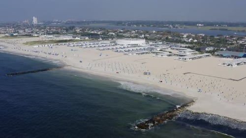 Flying over the coastline toward a private beach club of Long Beach in LI