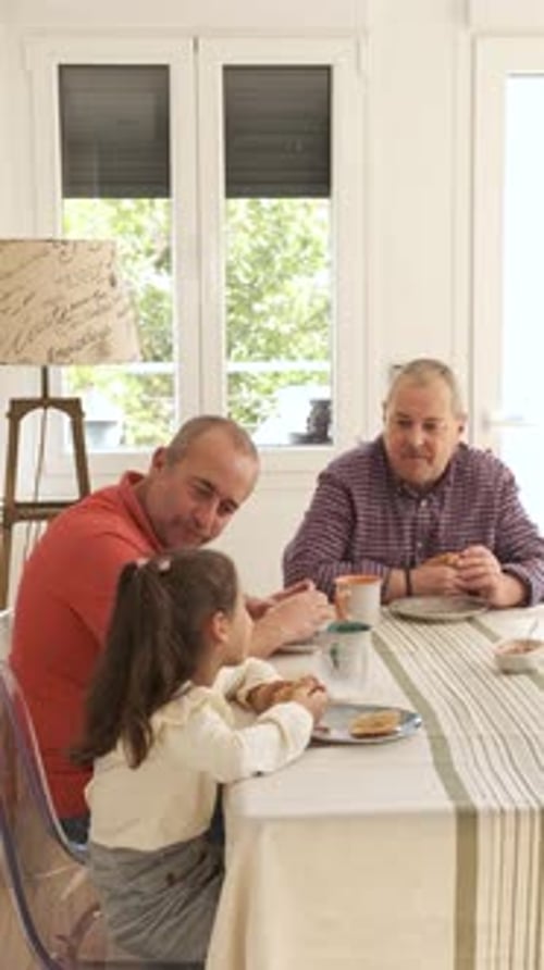 Family Eating Breakfast Together at Home