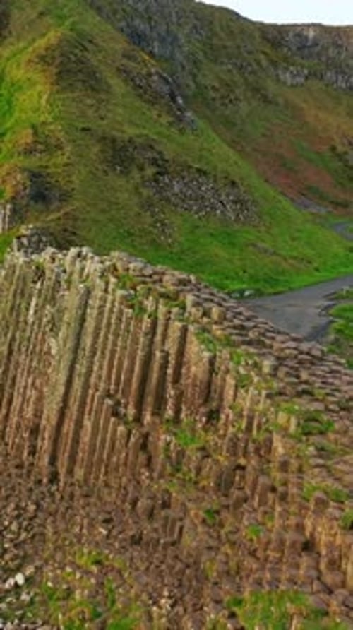 Social ratio aerial video of the high colums at The Giant's Causeway in Bushmills, Northern Ireland