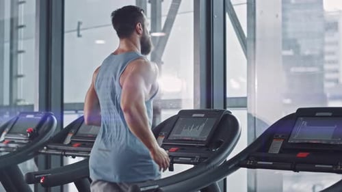 Man Working Out on Treadmill in Gym
