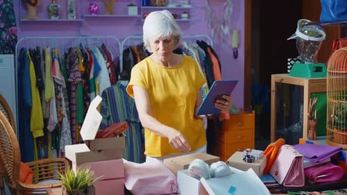 Senior woman selling clothes and accessories online