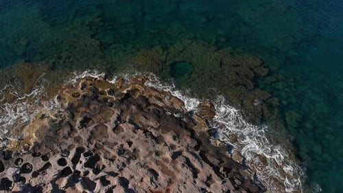 Aerial beautiful beach and water bay in the greek spectacular coast line. Turquoise blue transparent
