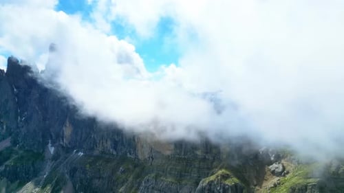 View from above, stunning aerial view of the mountain range of Seceda during a cloudy day