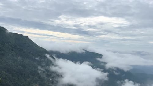 The mountains are covered by clouds.
