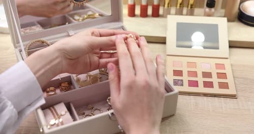 Woman Trying on Rings at a Vanity