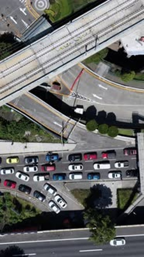Overhead view of interurban train lines and congested roads in Santa Fe, CDMX
