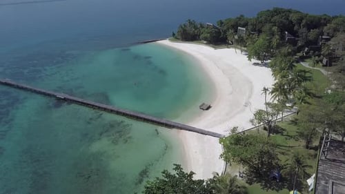 Aerial view of paradise island Koh Kham,Thailand descending slowly from the top of the resort.