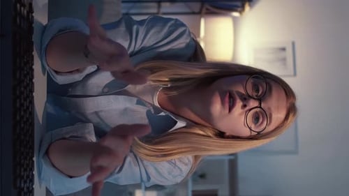 Young Woman Communicating Via Video Call at Night