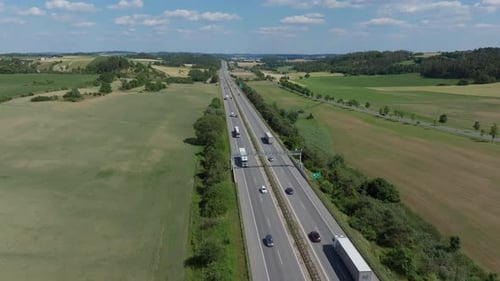 Cinematic Drone Flight Over a Bustling Highway