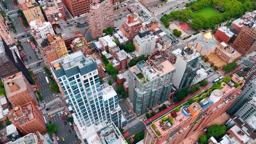 Flight over the cozy districts of New York with beautiful buildings. Lifestyle of modern metropolis.