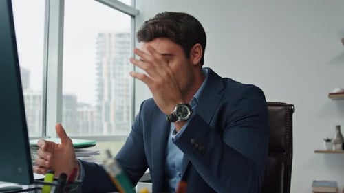 Stressed Executive Talking Computer in Office. Annoyed Businessman Explaining Complaining Colleagues