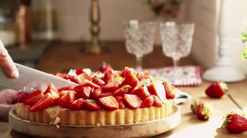 Delicious Strawberry Tart Being Cut on Wooden Board