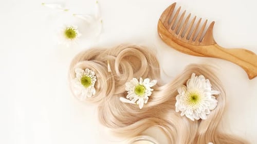 Blonde Hair with Flowers and Comb Flat Lay