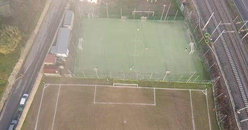 Children age 14-15 soccer match close to a train local line. Tuscany hills area near Arno river. Flo