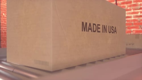 Packaging Box on Factory Conveyor With American USA Flag Background