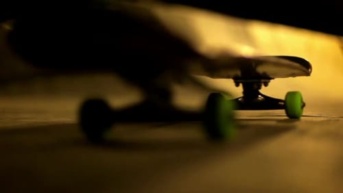 Closeup of Skateboard Move in and Out of Frame/Skate Close Up/Skateboard With