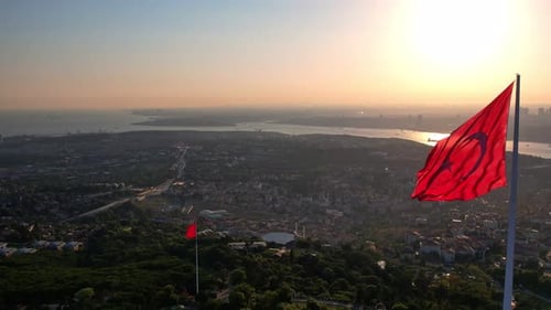 Urban Aerial View with Large Flag at Sunset