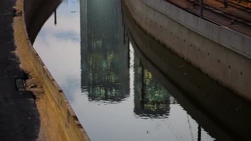 Skyscraper reflection in the river, static shot