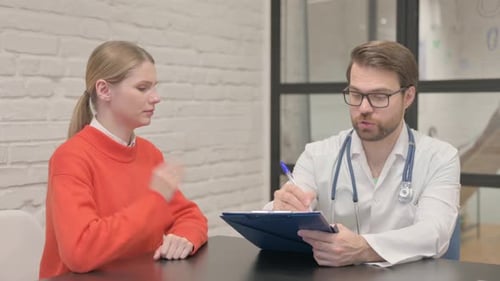 Woman Consulting with Doctor in Modern Office