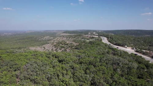 Cars drive along FM32 on Devil's Backbone outside of Canyon Lake, Texas in the Hill Country