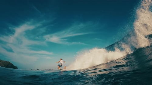Surfer Rides the Ocean Wave in the Maldives In Water and Underwater View of the Surfer on the Wave
