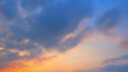 Clouds Moving Across Vivid Sunset Sky