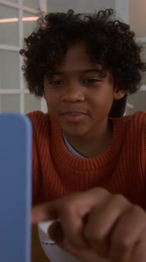 Cute Child Scrolling in Smartphone and Laughing at Funny Online Shorts