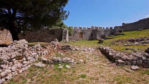 Old castle walls with remains in inner yard, dolly forward view