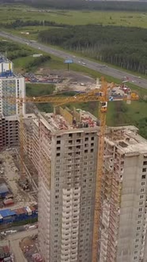 Vertical of Aerial Day Fly Over Under Construction New Modern Building Work Builders and Technicals