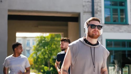 Group of Men Running Together for Exercise