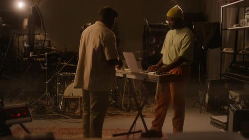 African American Musicians Preparing for Rehearsal in Recording Studio