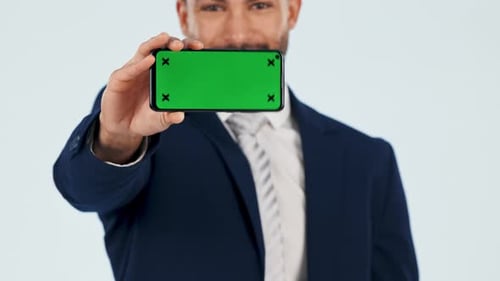 Pointing, business man and green screen of phone for advertising space, sign up offer