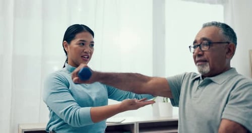 Man Doing Arm Exercises With Physical Therapist