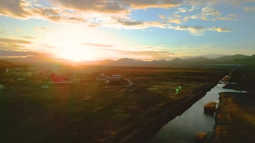 Golden Sunset over Tranquil Rural Landscape