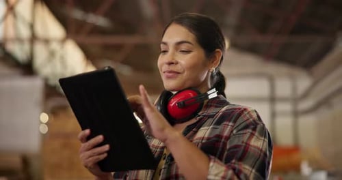 Carpenter, woman and smile with tablet in workshop or headphones of safety